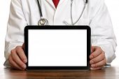 picture of medical doctors  - Doctor holding up and showing digital tablet with a blank screen - JPG 