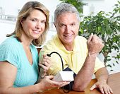 picture of pressure  - Seniors couple at home measuring blood pressure - JPG 