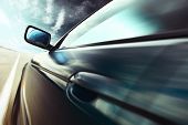 stock photo of tilting  - Motion blurred car on road - JPG 