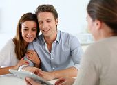 image of meeting  - Young couple meeting financial adviser - JPG 