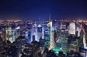 image of time  - New York City Manhattan Times Square panorama aerial view at night with office building skyscrapers skyline illuminated by Hudson River - JPG 