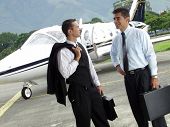 picture of leadership  - Business people working outsider on private jet background - JPG 