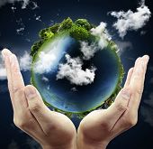 foto of globe  - holding a glowing earth globe in his hands - JPG 