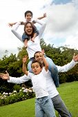 foto of family  - family lifestyle portrait of a dad with their two kids having fun outdoors - JPG 