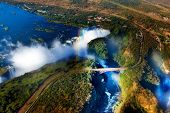 stock photo of world  - Victoria Falls or Mosi-oa-Tunya is the widest waterfall in the world, located in southern Africa on the Zambezi River between the countries of Zambia and Zimbabwe.
Victoria Falls is  UNESCO World Heritage Site. - JPG 