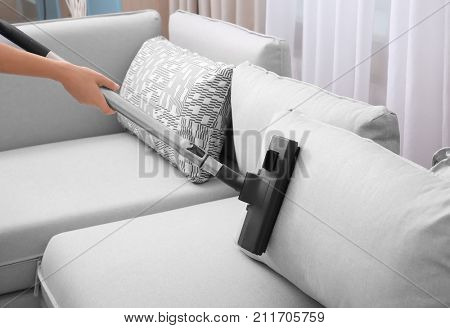 couch vacuum cleaner upholstery attachment poster of woman cleaning couch with vacuum cleaner at home poster id211705759 couch vacuum cleaner upholstery attachment poster of woman cleaning couch with vacuum cleaner at home poster id211705759