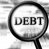 stock photo of debt  - debt in the paper with a magnifier - JPG 