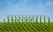 image of sky  - wind turbines covered with grass in a field - JPG 
