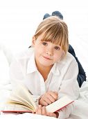 stock photo of education  - Girl on bed reading book  - JPG 