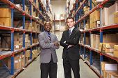 stock photo of businessmen  - Portrait Of Two Businessmen In Warehouse - JPG 