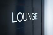 pic of wait  - Close up view of black sign with big white inscription Lounge - JPG 