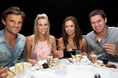 pic of restaurant  - Two young couples in restaurant - JPG 