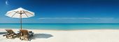 pic of beach  - Panoramic view of two chairs and white umbrella on the beach - JPG 