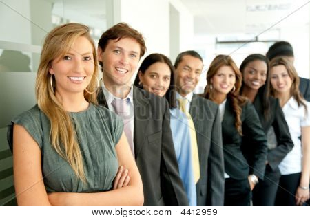 Picture or Photo of Group of business people smiling in an office lined up