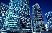 stock photo of buildings  - Tall office buildings by night - JPG 