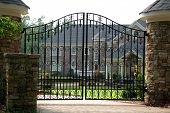 pic of gate  - Brick mansion behind iron gate - JPG 