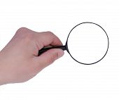 stock photo of magnifying  - Hand holds a magnifying glass isolated on a white background - JPG 