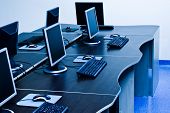 image of future technology  - computers with LCD screens in IT office - JPG 