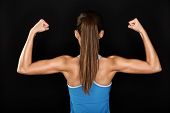 picture of fitness  - Strong fitness woman showing back and biceps muscles strength - JPG 