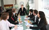 stock photo of meeting  - image of a young executive woman leading a business meeting - JPG 