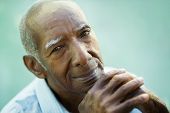 stock photo of nature  - Portrait of happy senior hispanic man looking at camera and smiling - JPG 