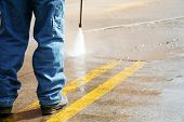 pic of pressure  - powerwashing the parking lot and cleaning the stripes - JPG 