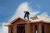 stock photo of construction worker  - New home under building construction on the exterior - JPG 