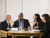 image of business people  - A group of business people are in a meeting in an office - JPG 