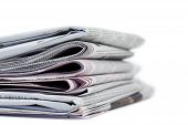 image of newspaper  - Pile of newspapers on a white a background - JPG 