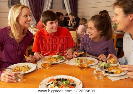 Picture or Photo of Family Eating Lunch Together In Restaurant