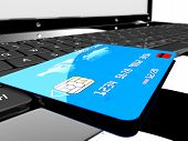 stock photo of payment  - A blue credit card on a laptop - JPG 