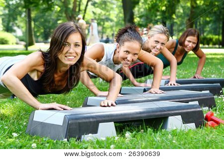 Picture or Photo of Young and attractive people group doing fitness exercises