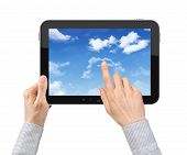 stock photo of businessmen  - Businessman hands are holding and point on contemporary tablet pc with cloudscape on screen - JPG 
