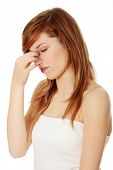 picture of pressure  - Young teen woman with sinus pressure pain - JPG 