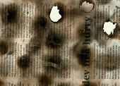 pic of newspaper  - Broken burnt newspaper article - JPG 