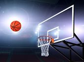 picture of spotlight  - Basket ball heading the hoop with spotlights - JPG 