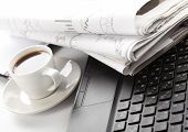 picture of news  - Cup of fragrant coffee on a morning paper business news - JPG 
