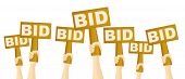 pic of competition  - Hands holding BID sign to buy from auction - JPG 