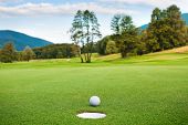pic of golf  - golf ball on tee in a beautiful golf club - JPG 