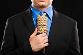 picture of pressure  - Businessman with a rope in place of a collar - JPG 