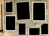 stock photo of  photo  - Page of vintage photo album with blacked out photo frames - JPG 