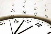 stock photo of time  - Clock face pointing to midday and calendar numbers - JPG 