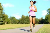 stock photo of health  - Sport fitness woman running in park on summer day - JPG 
