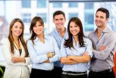 picture of teamwork  - Happy business team with arms crossed at the office - JPG 