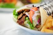 picture of warp  - beef gyro wrap with cucumber red onions and fries - JPG 