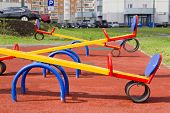 picture of teeter  - Colored Swing on playground with safe rubber coating - JPG 