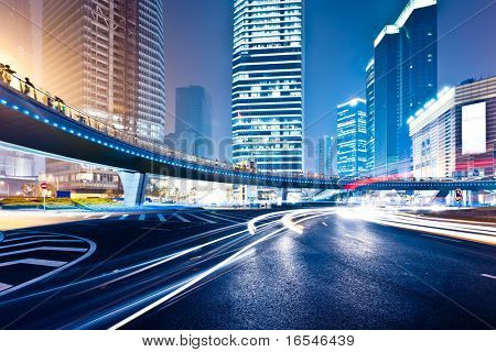 Picture or Photo of The light trails on the modern building background in shanghai china.