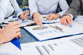 stock photo of meeting  - Business people team work group during conference discussing financial diagram - JPG 