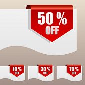 foto of edges  - Red discount labels bent around paper edge - JPG 