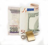 stock photo of security  - Various foreign currency cash with padlock isolated on a white background concept locked financial security - JPG 